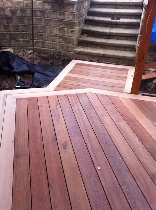 Merbau deck with a picture-frame border and stepped platform running up to garden stairs